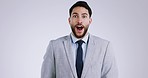 Wow, surprise and face of business man in studio for celebration of bonus, payment and good news. Success, excited and portrait of person for winning, promotion and announcement on gray background