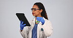 Scientist woman, tablet and glass flask for research, medical analysis and exam or healthcare analysis in studio. Science expert, digital tech and green liquid for chemistry test on white background