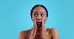 Black woman, whisper and hand on mouth for gossip, secret and privacy emoji in studio on blue background. Person, natural beauty and confidential gesture for announcement or information with smile