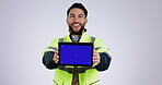 Screen, chromakey and man engineer with tablet for construction promotion isolated in a studio white background. Smile, professional and portrait of architecture worker with internet or online app