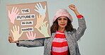 Protest, future and poster with a woman activist in studio on a gray background for human rights. Portrait, change and politics with a young person at a rally for freedom from government oppression