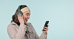 Music, cellphone or happy woman listen, dance or enjoy audio entertainment, online sound track or studio song. Smartphone app, headphone or person smile for podcast, radio or media on blue background