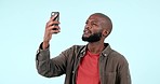 Phone, problem and black man in studio with connection, signal or network search on blue background. Smartphone, fail and African male model frustrated by app glitch, 404 or tech, web or disaster