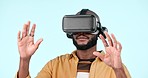 Virtual reality glasses, futuristic and black man with metaverse, augmented reality and gamer on a blue studio background. African person, guy or model with VR eyewear, future or technology with data