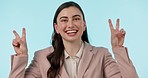 Face, business and woman with peace sign, support and career on a blue studio background. Portrait, person and employee with v gesture, emoji and Canada with professional style, icon and feedback