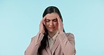 Stress, headache and businesswoman in a studio with sickness, medical emergency or pain. Frustrated, migraine and professional young female model with illness or allergies isolated by blue background