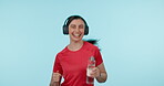 Fitness, headphones and a woman with a water bottle in studio for cardio workout, run or exercise. Happy athlete person or runner portrait while listening and streaming music on a blue background