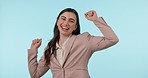 Happy, dance and face of business woman in studio celebration for startup, sale or loan success on blue background. Portrait, smile and excited female winner celebrating sale, growth or career goals