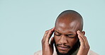 Businessman, headache and black man in studio with pain and burnout from corporate job and mental health. Face, person and stress with anxiety and brain fog from audit career on blue background