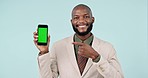 Phone green screen, point or professional black man gesture at online mockup, corporate promo or studio news. Smartphone tracking markers, advertising space or portrait businessman on blue background