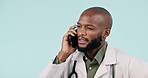 African doctor man, phone call and studio with thinking, advice or talking for healthcare by blue background. Medic, smartphone conversation and consulting for results, news or progress with wellness