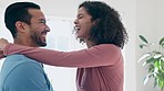 Couple, dance and home with laughing for happiness or smile in connection at apartment. Interracial people, love and listening to music in morning together to relax in hug, romance or partnership