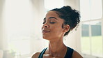 Face, yoga and meditation to relax with a woman closeup in a home for fitness, mindfulness or awareness. Exercise, zen and breathing with a young person in an apartment for health, wellness or peace