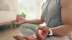 Hands, lotus and meditation with man and yoga home, fitness and mindfulness with zen, calm and spiritual. Prayer, peace and exercise in living room, health and wellness for healing and self care