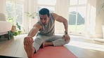 Yoga, stretching legs and man exercise in home, workout and flexibility for healthy body. Pilates, fitness and athlete warm up, training practice and holistic meditation for wellness in living room