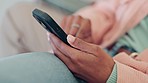 Phone, hands and closeup of woman typing a text message on the internet and relaxing on a sofa. Technology, networking and female person scroll on social media or mobile app with cellphone at home.