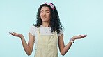 Face, confused and woman shrug in studio isolated on a blue background mockup space. Doubt, portrait and person puzzled with choice, decision or option, dont know question and unsure of body language