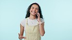 Woman, smile and phone call communication in studio for discussion, conversation and mobile contact on blue background. Happy model, smartphone and news of funny chat, social networking and talking