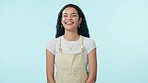 Happy, woman and laughing face with gen z, style and modern fashion in a studio. Funny joke, portrait and female person from Brazil with smile and blue background with confidence and trendy clothes