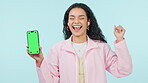 Happy woman, phone and dancing with green screen for podcast or audio streaming against a studio background. Excited female person and mobile smartphone display, mockup or enjoying listening to music