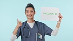 Nurse, face and pro vaccination sign with thumbs up and a woman with wellness, healthcare and shot banner. Vaccine, smile and portrait with health opinion, yes and medical advice with blue background