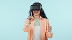 Woman, student and VR glasses in futuristic e learning, software or user experience on a blue background. Wow, excited  and person in virtual reality, education screen and future technology in studio