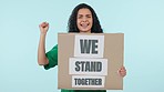 Poster, protest for unity or solidarity and a woman in studio on a blue background for human rights. Portrait, change or transformation with a confident young activist showing a sign of support