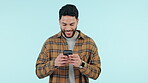 Happy man, phone and typing in social media, communication or networking against a studio background. Male person smile for online search, texting or chatting on mobile smartphone app on mockup space