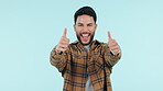 Happy man, thumbs up and winning in success, thank you or good job against a studio background. Portrait of male person smile with like emoji, yes sign or OK for approval, positive or agree on mockup