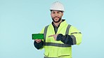 Construction worker, green screen phone and studio with pointing, app promo or face by blue background. Engineer, maintenance employee or contractor with smartphone mockup, tracking markers and space