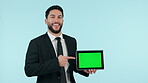 Professional man, tablet green screen and presentation, website space, business information and advertising in studio. Face of corporate worker, digital mockup and tracking marker on blue background