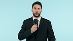 Face, man and news reporter speaking on microphone in studio isolated on a blue background mockup space. Portrait, journalist and professional in talk show, live stream broadcast media and tv anchor