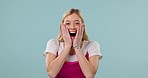 Surprise, excited and face of woman on blue background for good news, announcement and winning. Wow, omg and portrait of person in studio in happy, joy and cheerful facial expression for celebration