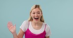 Hand, hello and face of happy woman in studio wave, calling and excited greeting on blue background. Portrait, smile and female model with palm emoji for attention, hey or bye, come or waving sign