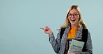 Hand, pointing and woman in college with a choice, presentation or student registration information on studio background. Happy, announcement and excited person with university decision or mockup