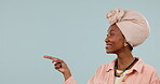 Mockup, black woman and hands point at product placement for marketing and advertising in studio with happiness. Smile, person and show display choice or option for deal or sale on blue background