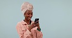 Smile, black woman and smartphone with connection, typing and social media on a blue studio background. African person, girl or model with a cellphone, mobile user or post with digital app or network