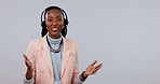 Happy black woman, call center and headphones on mockup in customer service against a studio background. Portrait of African female person, consultant or agent smile in online advice or telemarketing