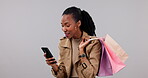 Woman, no and phone in shopping bag, retail mistake and e commerce debt, risk or stress in studio. Sad African customer for bad user experience on mobile, website or payment fail on white background