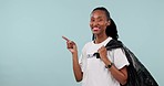 Trash bag, black woman point or volunteering okay gesture for pollution news, community service cleaning and charity info. Studio mockup space, ok emoji sign or NGO portrait person on blue background
