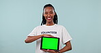 Happy black woman, volunteer and tablet green screen in advertising or marketing against a studio background. Portrait of African female person showing technology app or display in community service