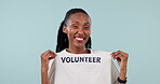 Volunteer, tshirt and a woman with hand gesture in studio to call or invite for community service. face of a happy black person on a blue background for volunteering, recruitment and accountability