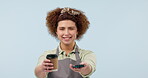 Woman with coffee, POS and card machine for finance, face and technology on blue background. Waitress in portrait, payment and financial transaction for small business, barista with drink in studio