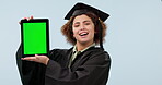 Tablet, green screen and a woman university graduate in studio on a gray background for education. Portrait, smile and college graduation with a student showing chromakey mockup space on a display