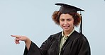 Graduate, pointing and woman in studio with decision, option and choice on blue background. University, college and portrait of student with hand gesture for education, certificate and qualifications