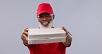 Senior, black man and pizza box for delivery, fast food or logistics against a studio background. Portrait of mature African male person or courier guy smile and giving meal, order or eating parcel