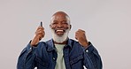 Face, phone call and black man with achievement, dance and connection on a grey studio background. African person, senior model or winner with cellphone, success and wow with prize, smile or giveaway