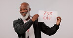 Sale, promotion and senior black man with sign for a deal or poster for giveaway isolated in a studio grey background. Smile, happy and portrait of elderly person with discount or saving announcement