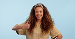 Face, happy and thumbs up of woman in studio isolated on a blue background mockup space. Portrait, like hand sign and person smile in agreement, approval of feedback in excellence and ok for success