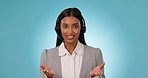 Call center, communication and face of woman in studio for customer service, FAQ advisory or IT questions. Portrait of indian telemarketing agent, virtual consultant or CRM contact on blue background